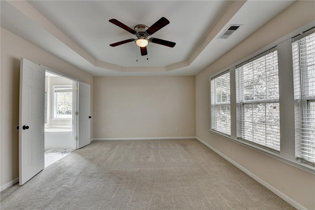 100 Hawnley Trc Northwest Suwanee, GA 30024 - Photo 39 of 58 a view of an empty room with a window