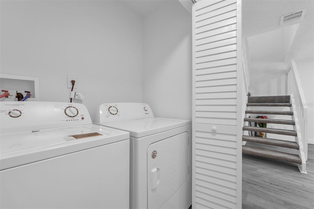 4402 Ring Neck Road, Unit 19B Orlando, FL 32808 - Photo 18 of 35 a utility room with dryer and washer