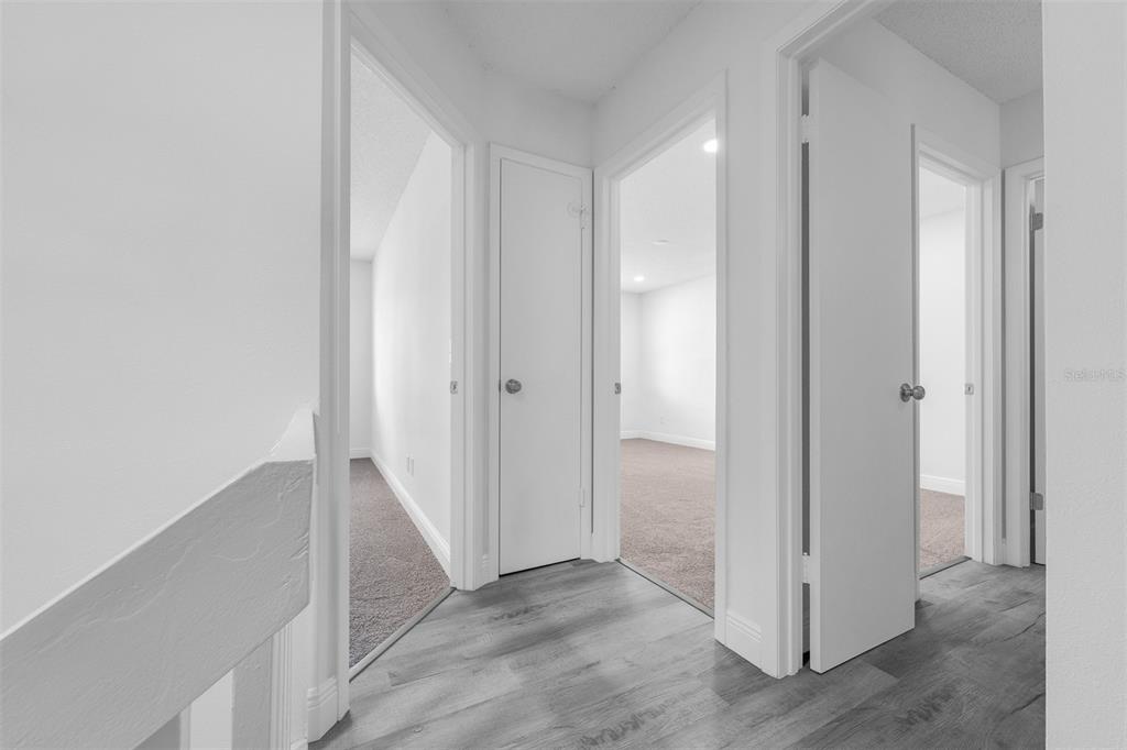 4402 Ring Neck Road, Unit 19B Orlando, FL 32808 - Photo 19 of 35 a view of a hallway with closet area