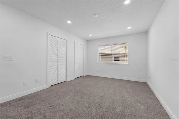 a bathroom with a toilet and a bathtub