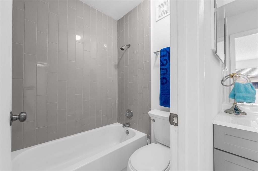 4402 Ring Neck Road, Unit 19B Orlando, FL 32808 - Photo 22 of 35 a bathroom with a toilet and a bathtub