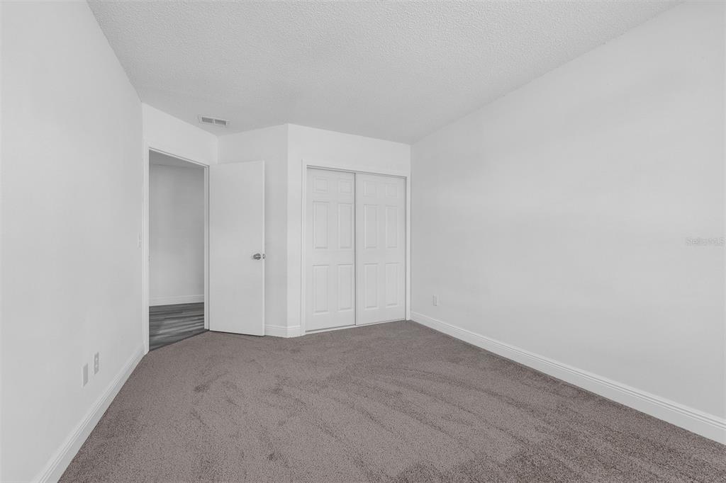 4402 Ring Neck Road, Unit 19B Orlando, FL 32808 - Photo 24 of 35 a view of an empty room