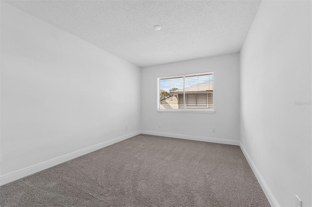 4402 Ring Neck Road, Unit 19B Orlando, FL 32808 - Photo 25 of 35 an empty room with a window