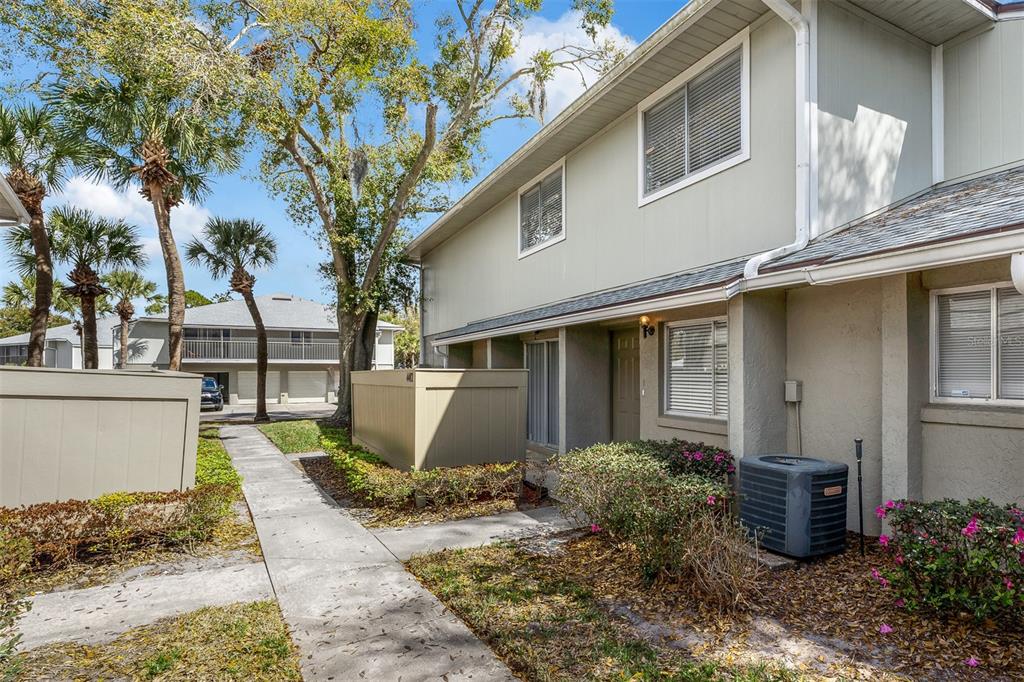 4402 Ring Neck Road, Unit 19B Orlando, FL 32808 - Photo 29 of 35 a front view of a house with garden