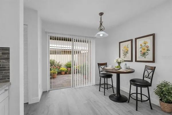 a view of a livingroom with furniture and wooden floor