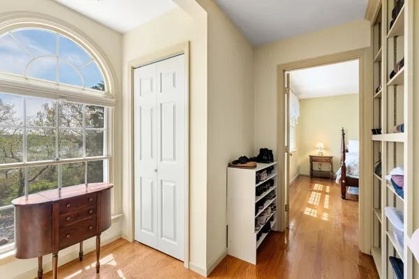 a very nice looking room with a large window and a wooden floor