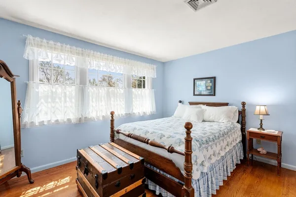 a bedroom with a bed and a desk