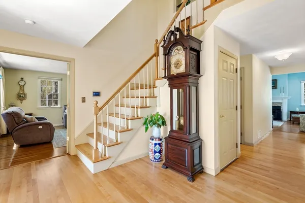 a view of entryway with wooden floor and furniture