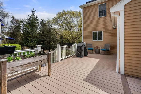 a balcony with wooden floor