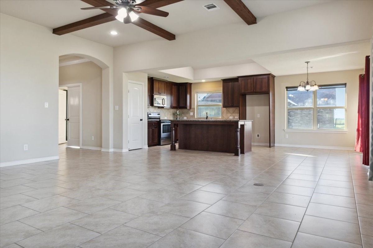 2407 Thuesen Road Beasley, TX 77417 - Photo 17 of 34 a view of a kitchen with a sink and a stove top oven