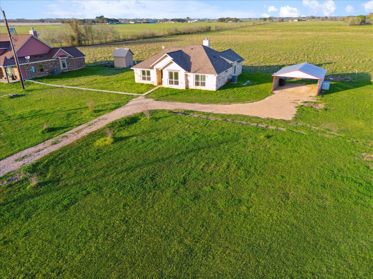2407 Thuesen Road Beasley, TX 77417 - Photo 6 of 34 an aerial view of a house with a garden and swimming pool