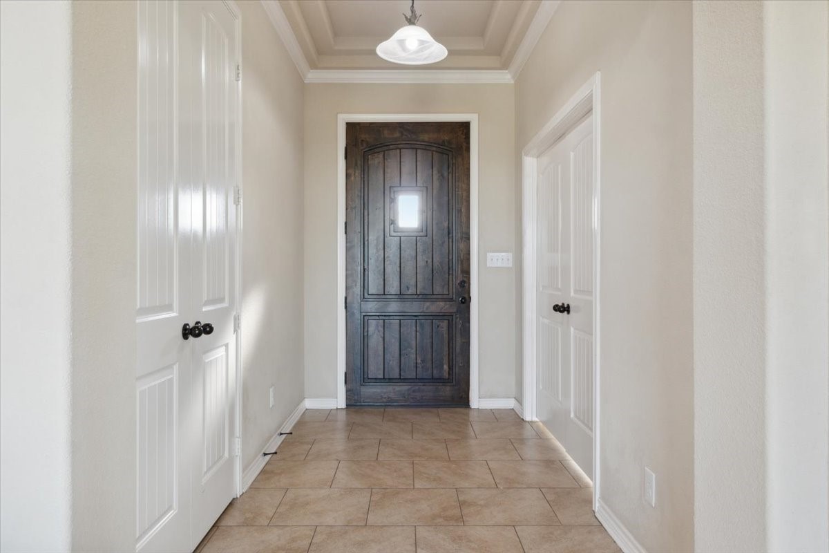 2407 Thuesen Road Beasley, TX 77417 - Photo 10 of 34 a view of a hallway with wooden shelves