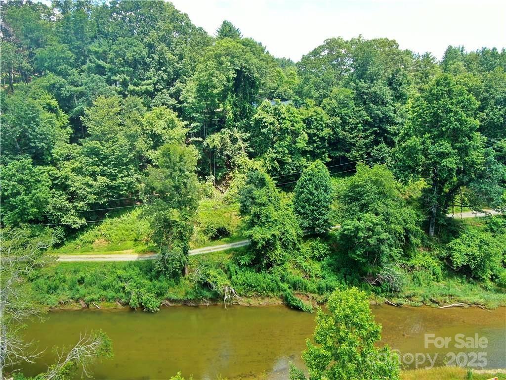 0 New River Heights Road, Unit 13 Boone, NC 28607 - Photo 6 of 7 a view of a lake with a yard