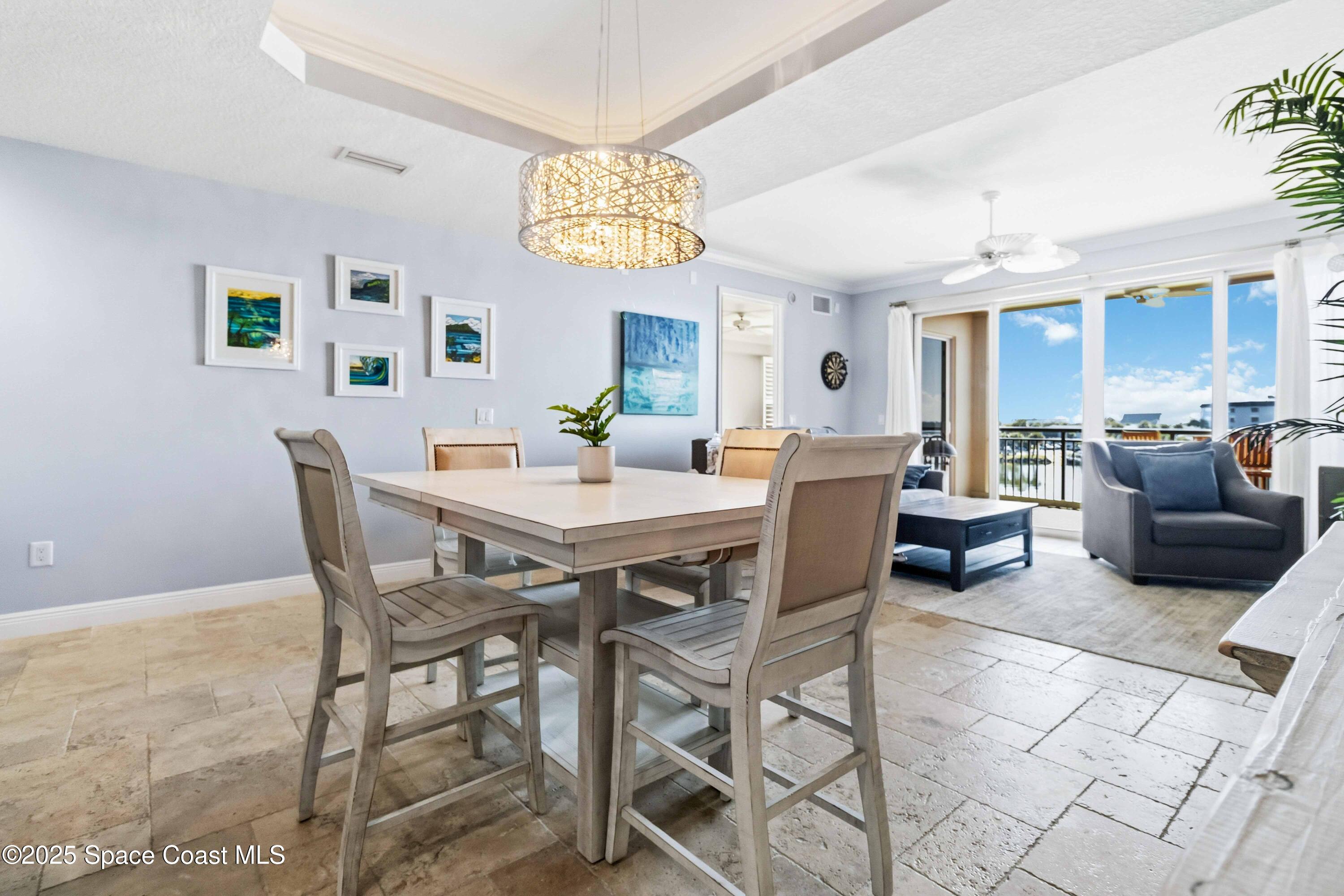 4125 West End Road, Unit 306 Cocoa Beach, FL 32931 - Photo 11 of 51 a view of a dining room with furniture