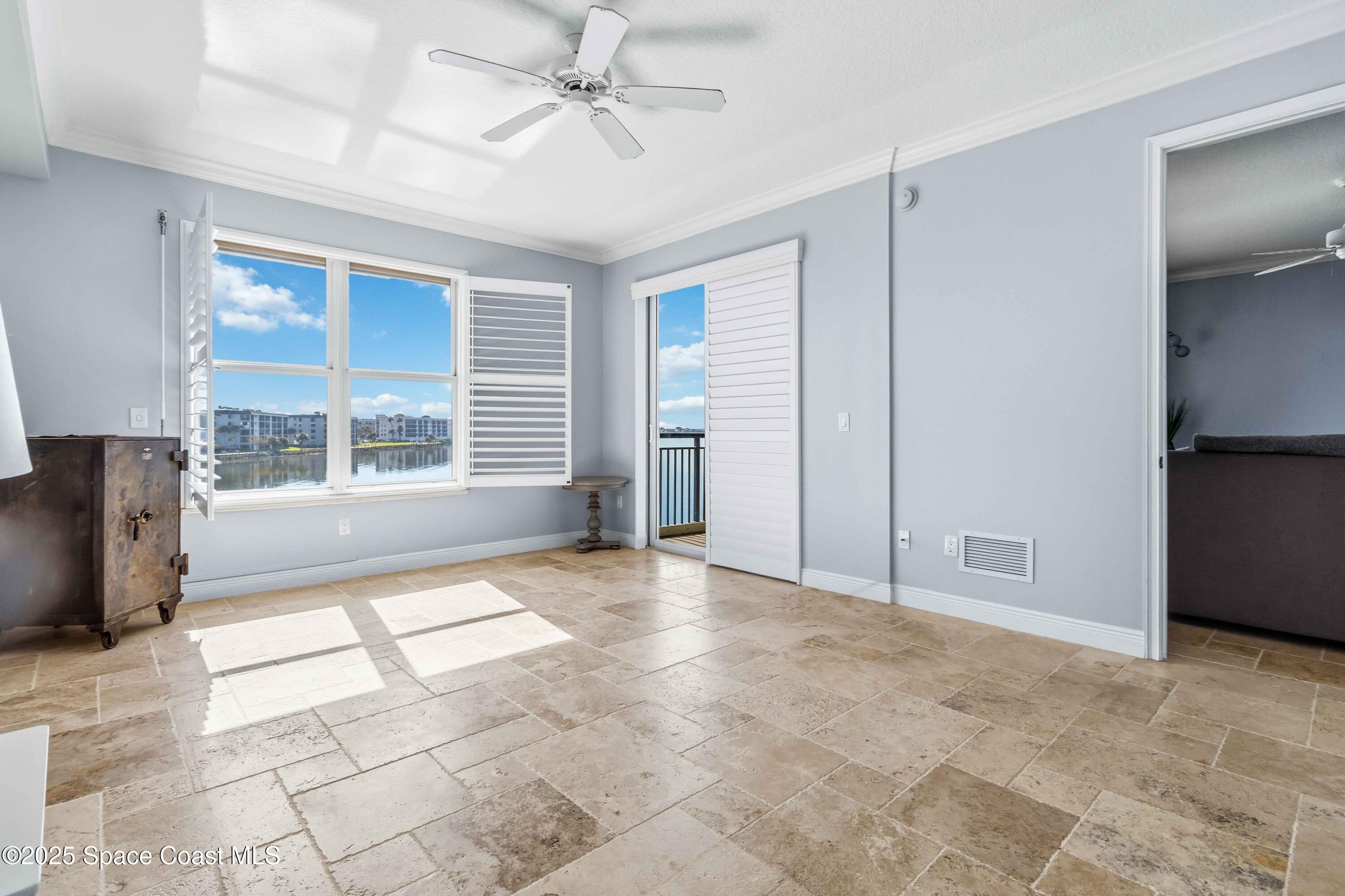 4125 West End Road, Unit 306 Cocoa Beach, FL 32931 - Photo 15 of 51 a view of an empty room with a window