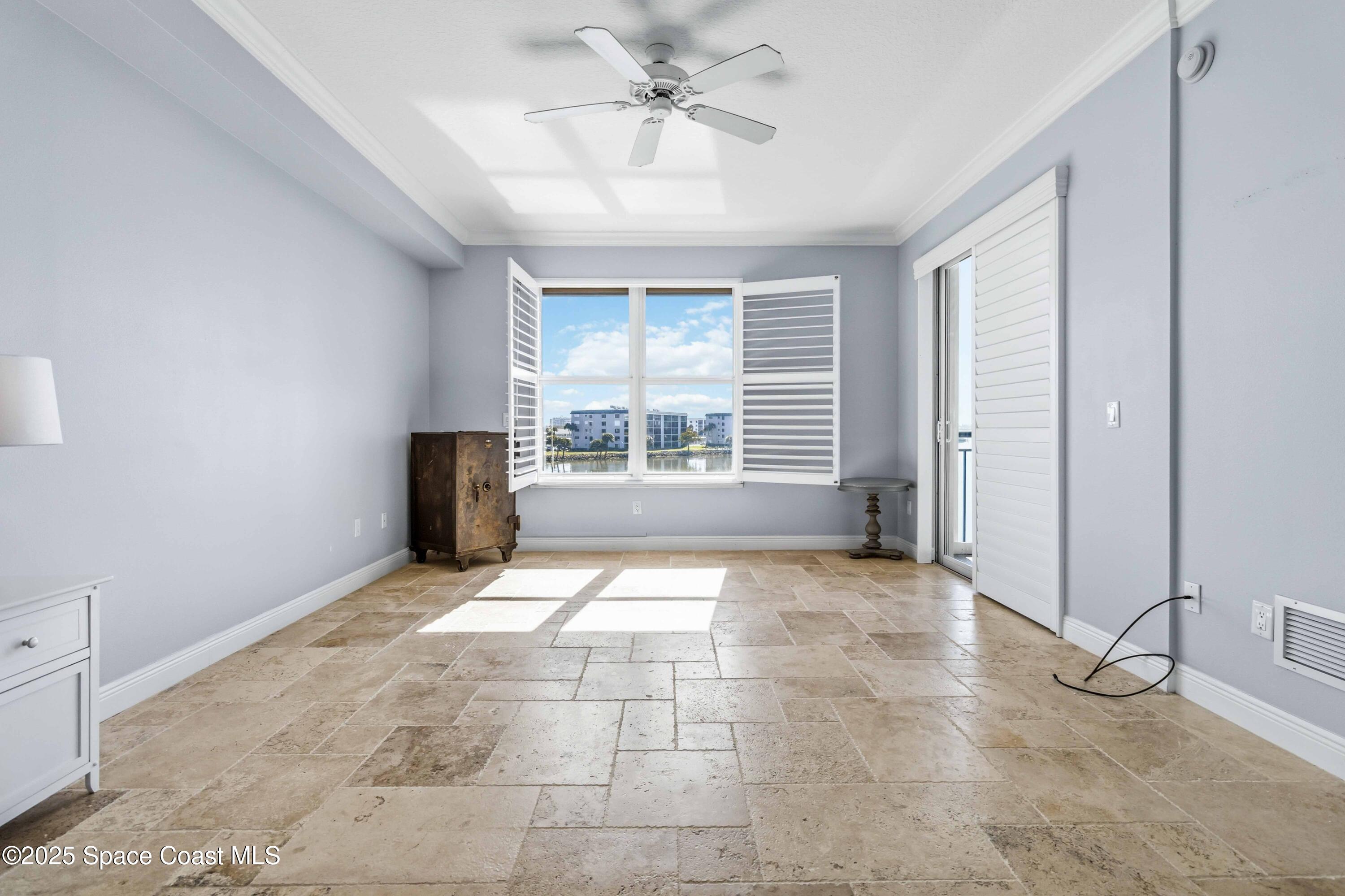 4125 West End Road, Unit 306 Cocoa Beach, FL 32931 - Photo 16 of 51 a view of an empty room with a window