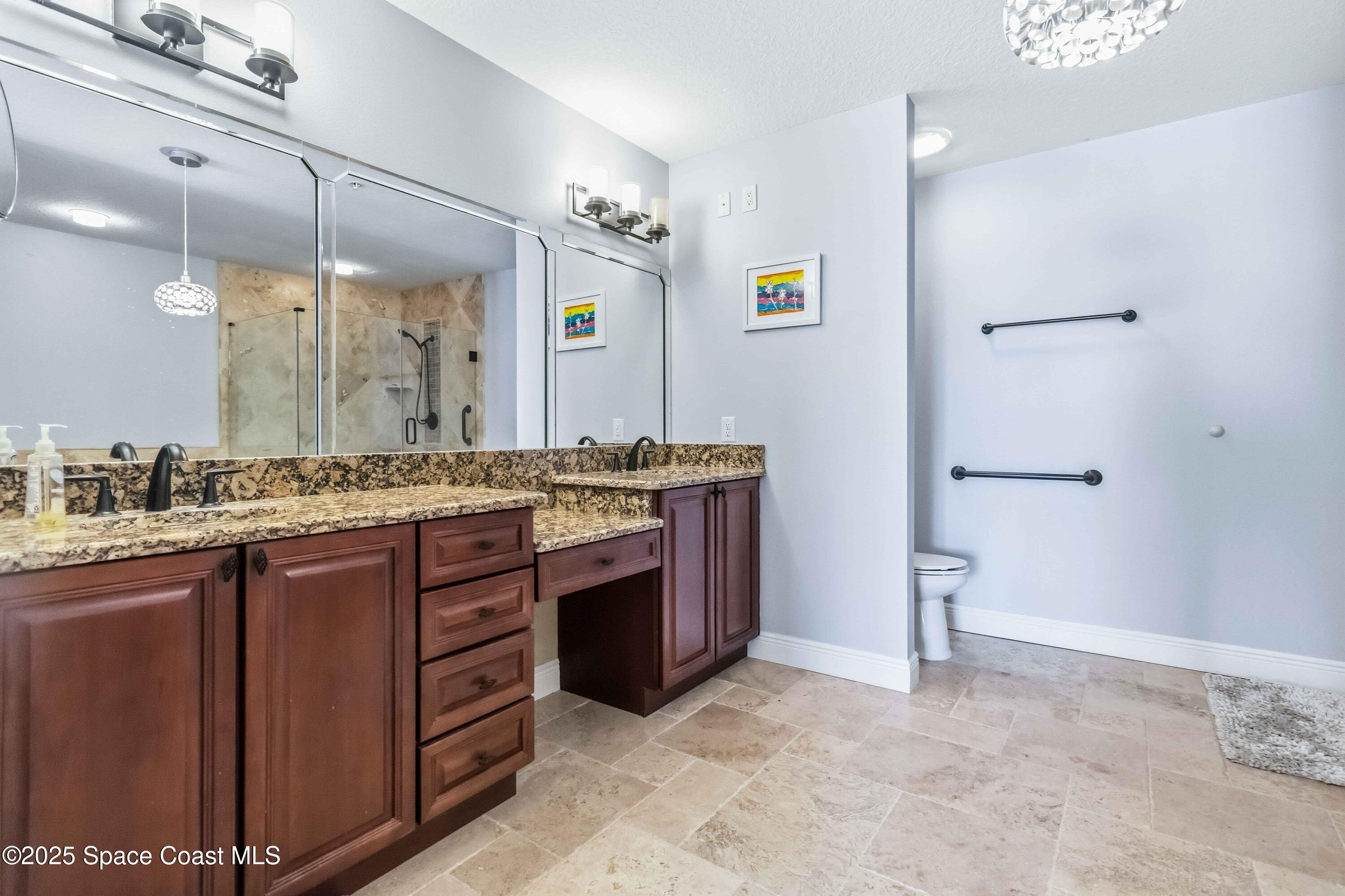4125 West End Road, Unit 306 Cocoa Beach, FL 32931 - Photo 18 of 51 a bathroom with a sink and a mirror