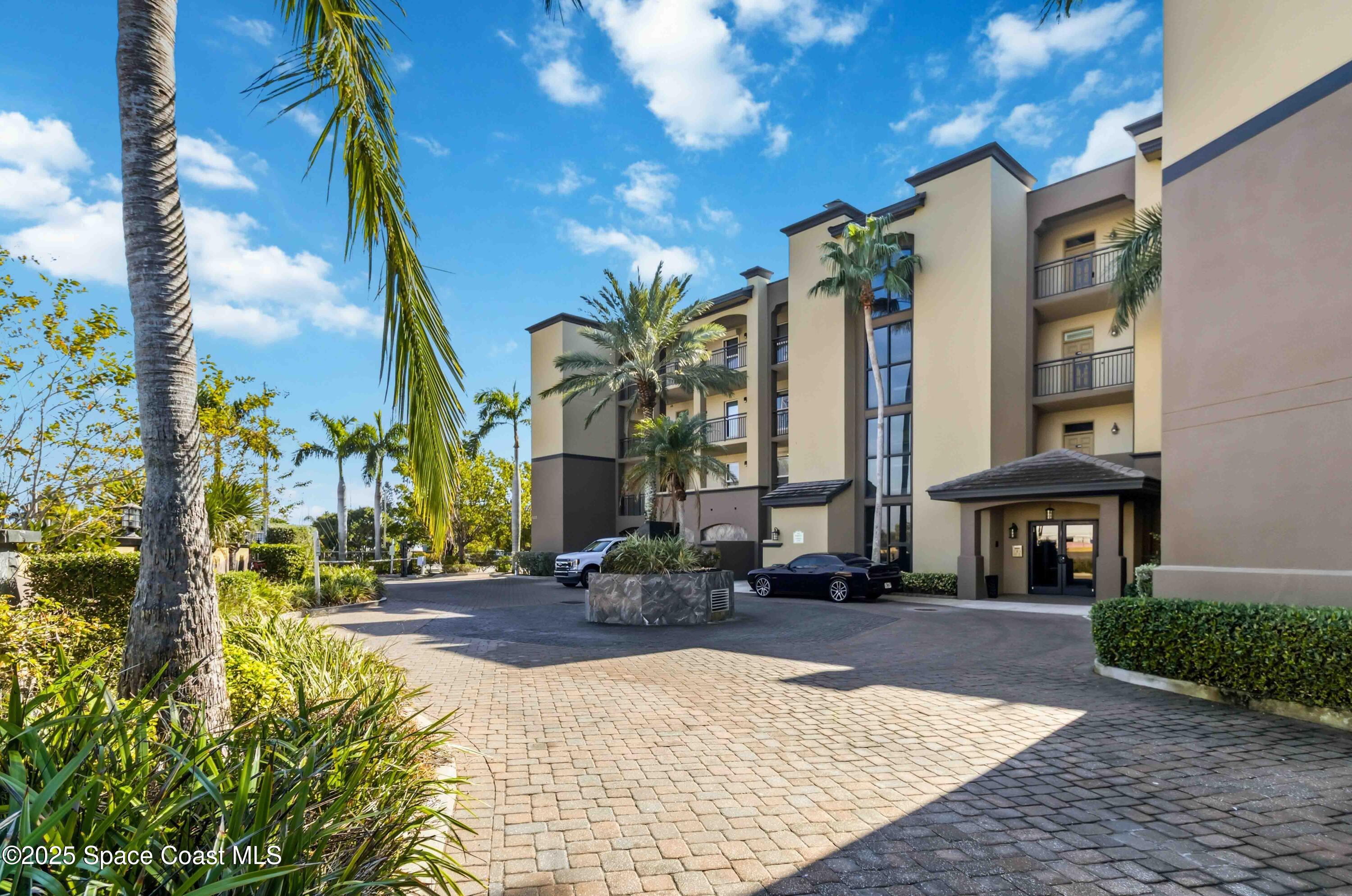 4125 West End Road, Unit 306 Cocoa Beach, FL 32931 - Photo 3 of 51 a front view of a building