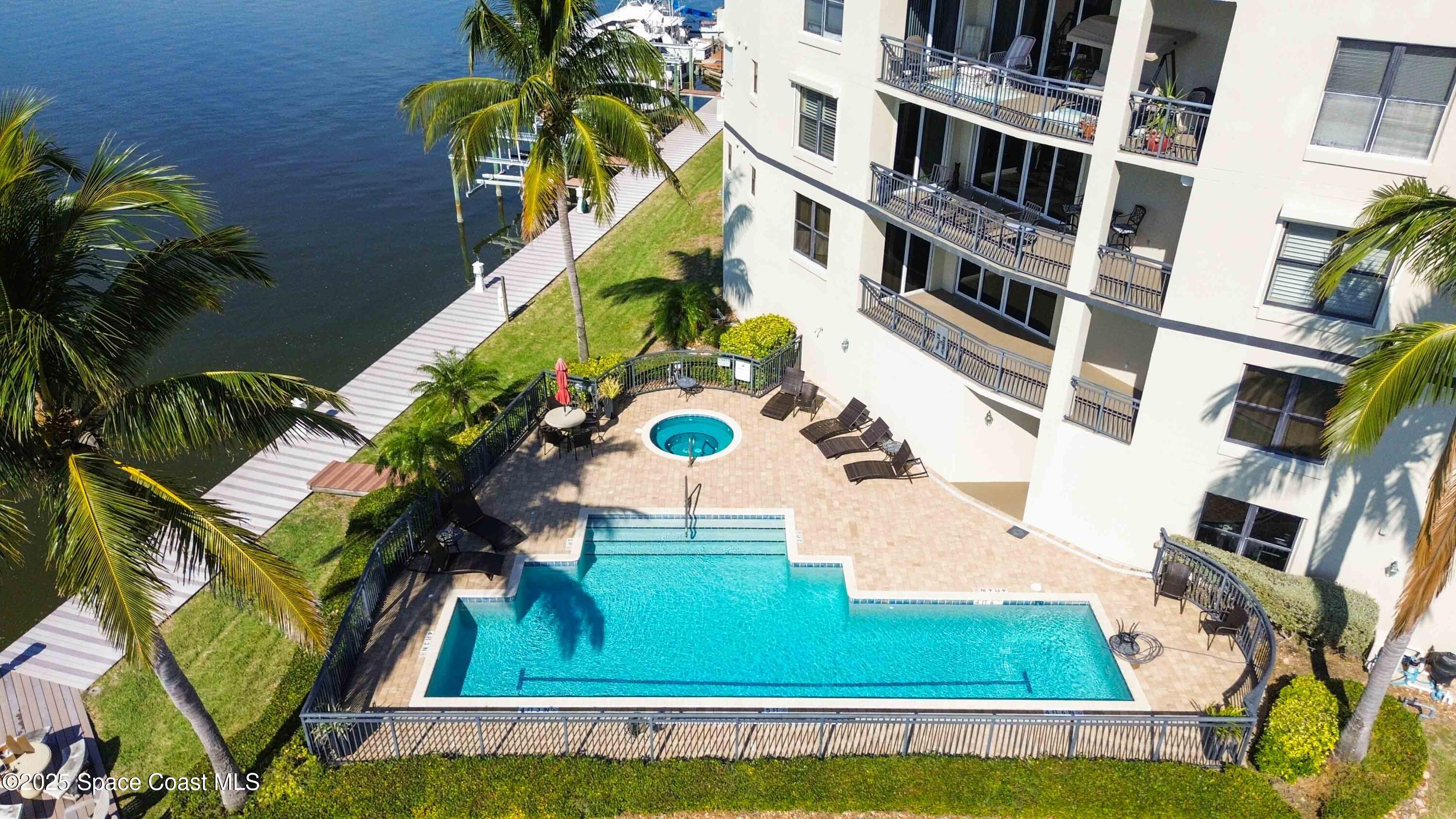 4125 West End Road, Unit 306 Cocoa Beach, FL 32931 - Photo 43 of 51 an aerial view of a house