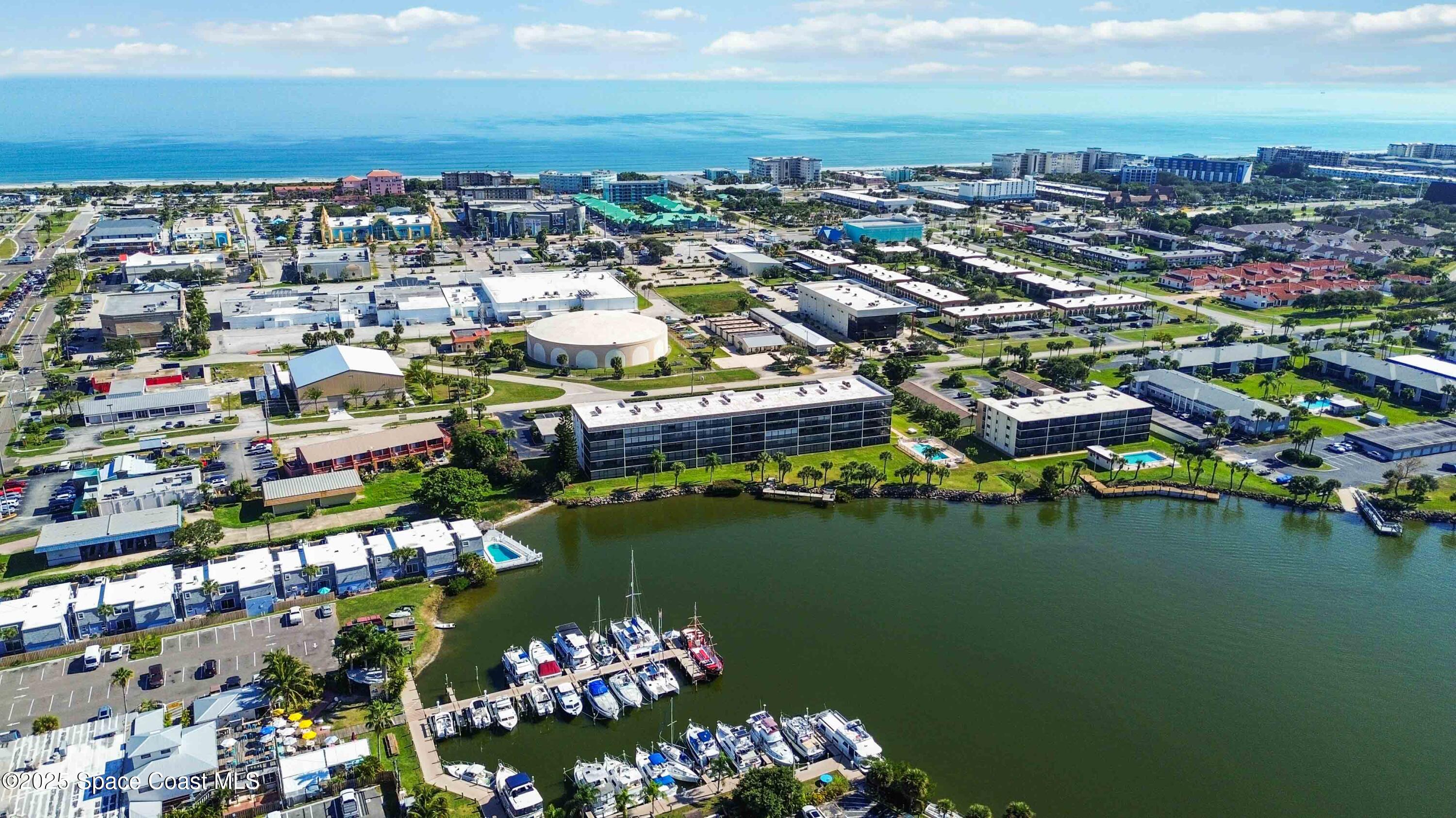 4125 West End Road, Unit 306 Cocoa Beach, FL 32931 - Photo 45 of 51 a view of a city and lake