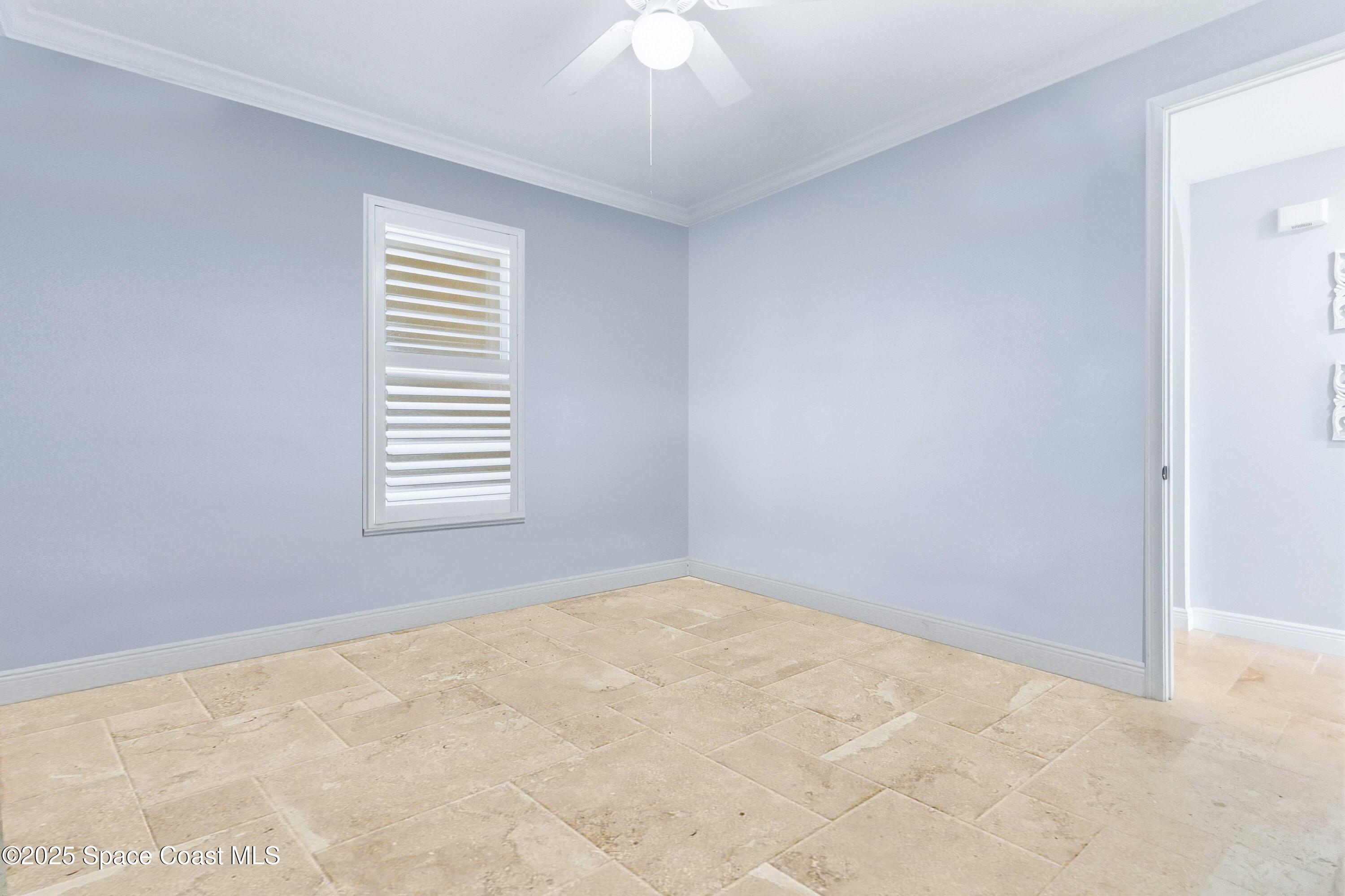4125 West End Road, Unit 306 Cocoa Beach, FL 32931 - Photo 46 of 51 a view of an empty room with a window