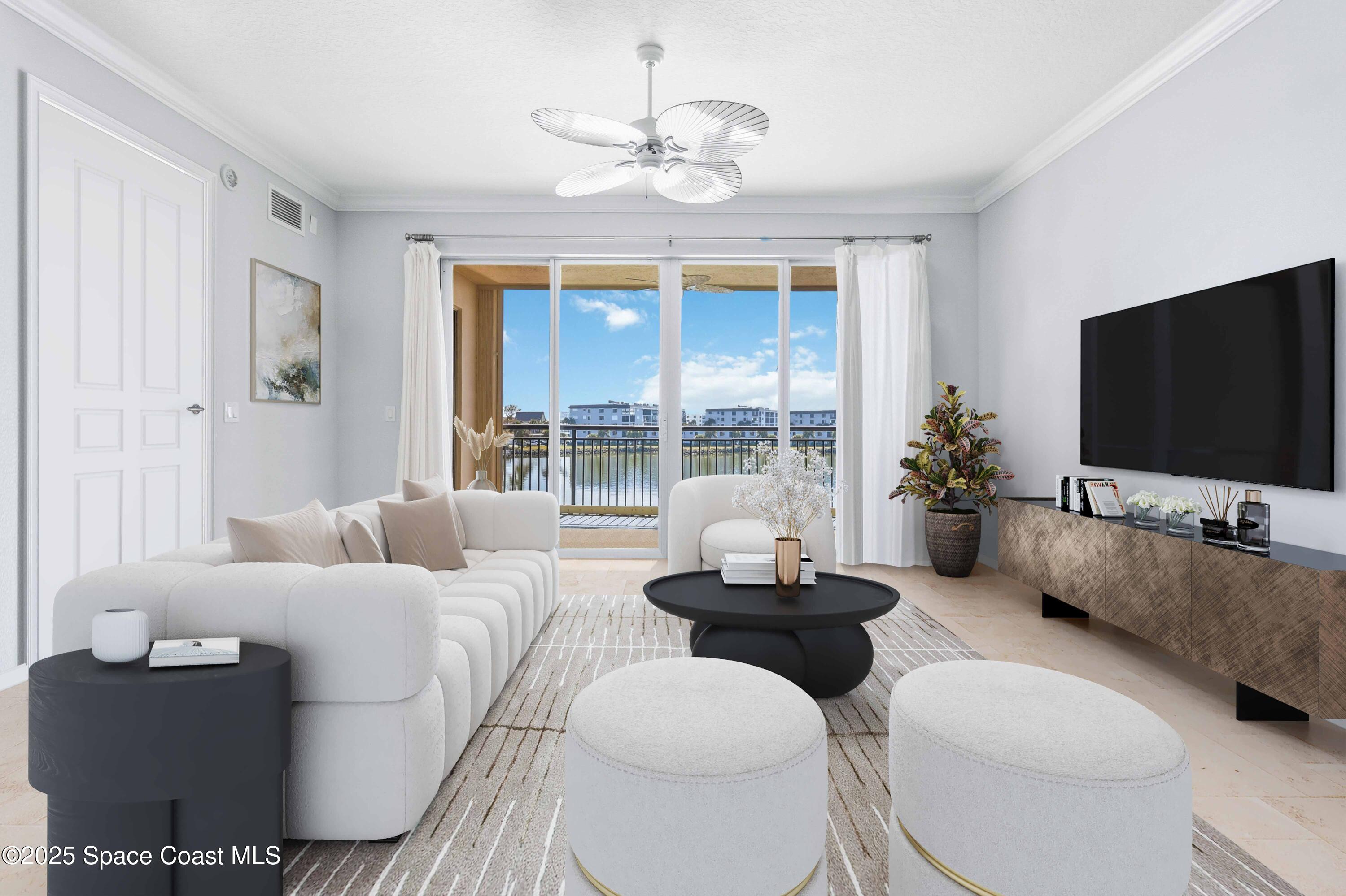 4125 West End Road, Unit 306 Cocoa Beach, FL 32931 - Photo 49 of 51 a living room with furniture a flat screen tv and a large window