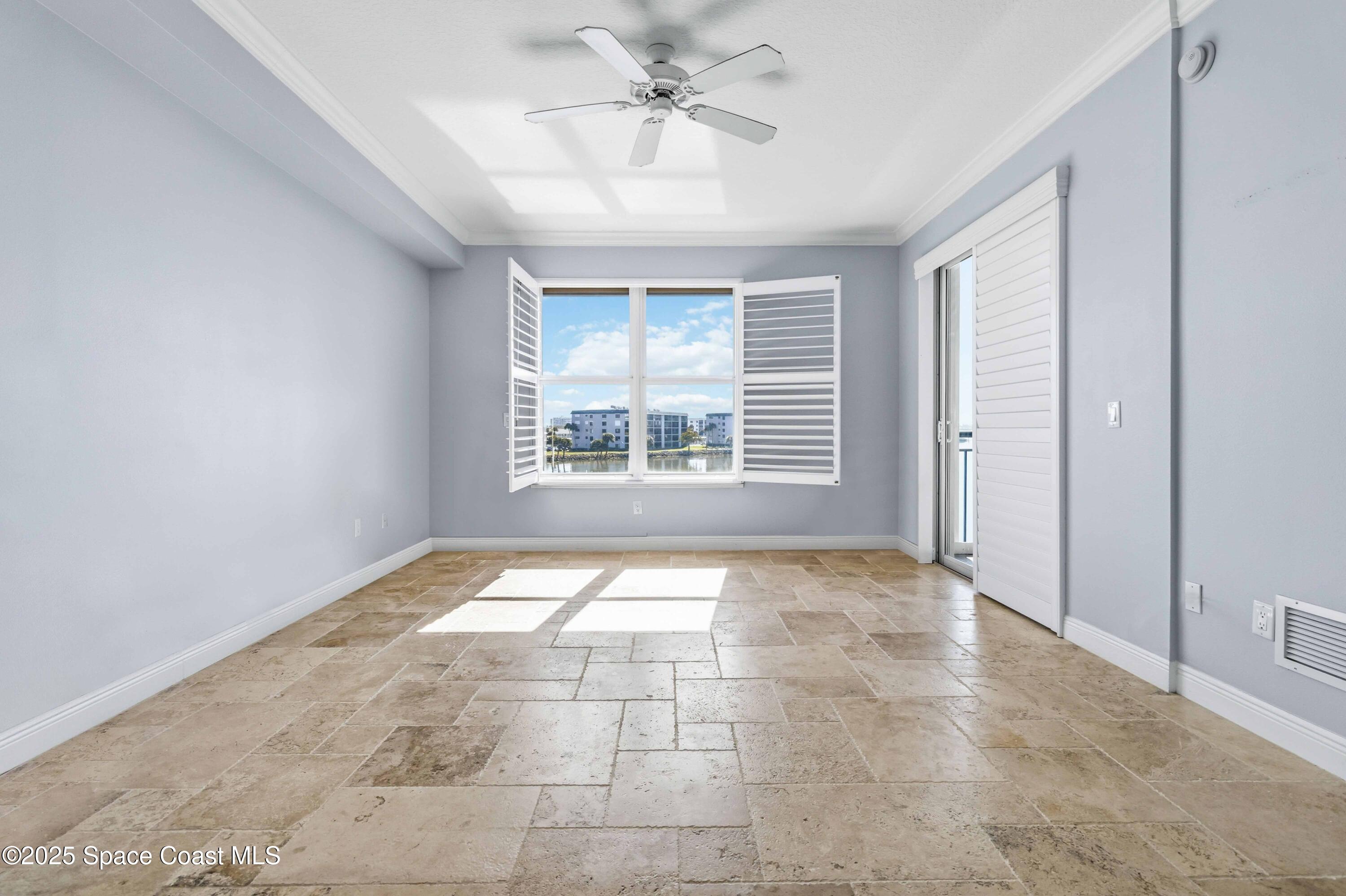 4125 West End Road, Unit 306 Cocoa Beach, FL 32931 - Photo 50 of 51 a view of an empty room with a window