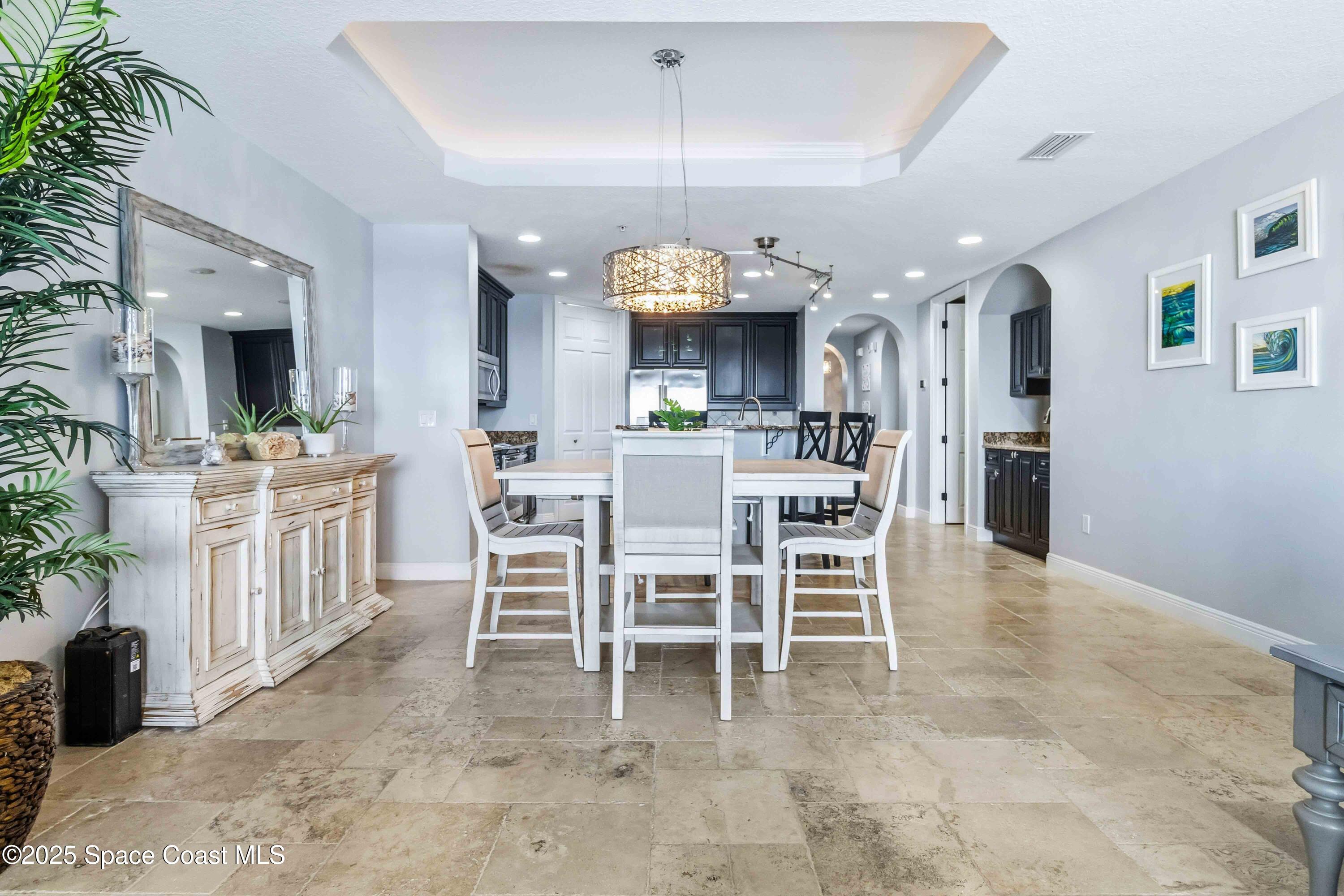 4125 West End Road, Unit 306 Cocoa Beach, FL 32931 - Photo 10 of 51 a view of a dining room kitchen and a window