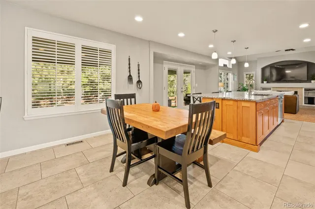 a view of a dining room with furniture window and outside view