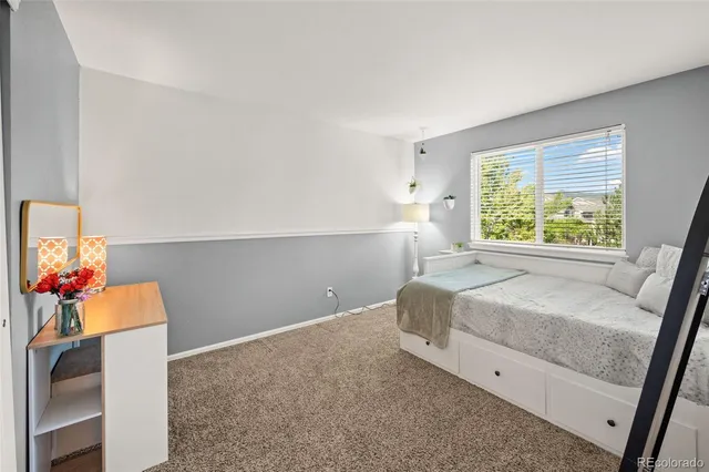 a room with a bed and a window