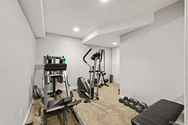 a backyard of a house with yard and outdoor seating