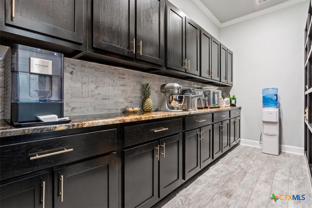 10940 Wedel Cemetery Road Rogers, TX 76569 - Photo 13 of 48 a kitchen with stainless steel appliances a sink dishwasher stove and cabinets