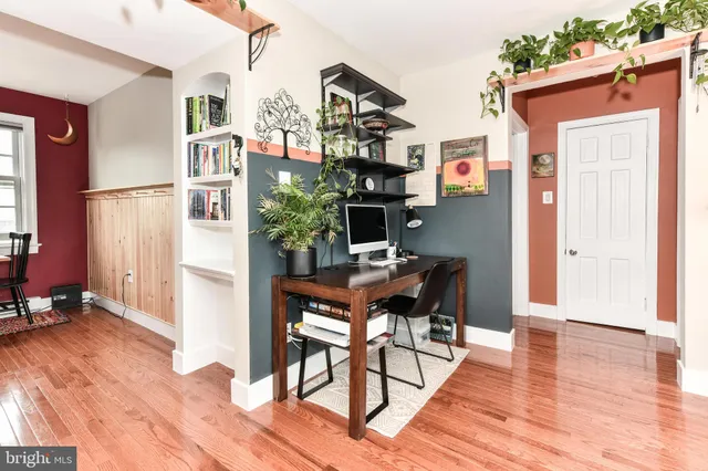 a workspace with furniture and wooden floor