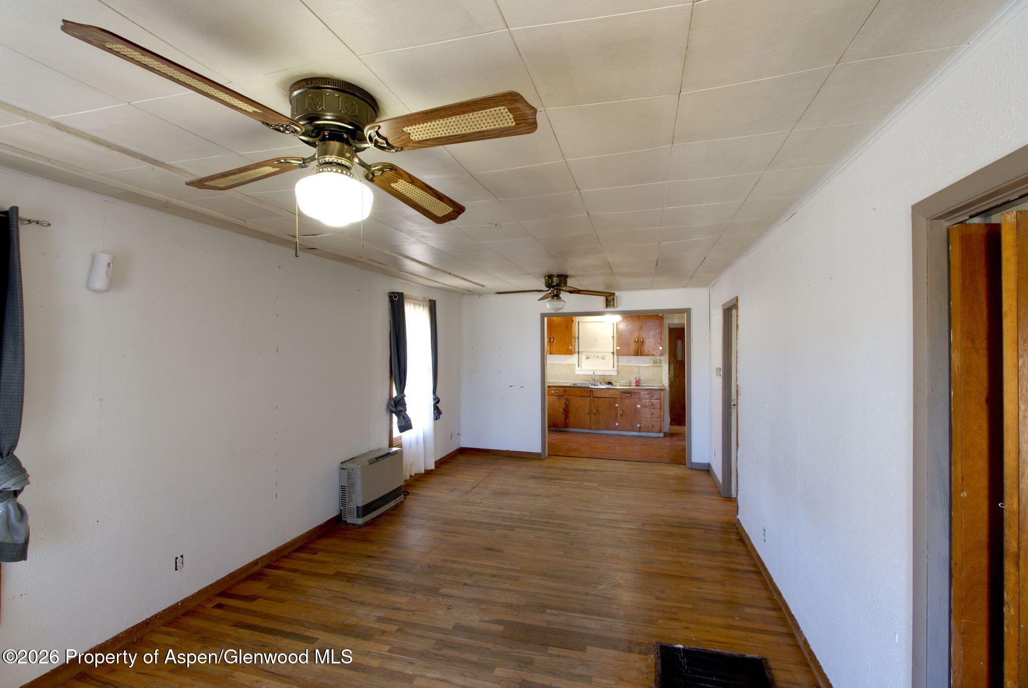 995 Colorado Street Craig, CO 81625 - Photo 5 of 21 a view of a hallway with a chandelier