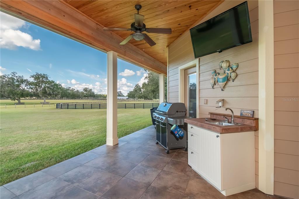 6140 Northwest 145th Avenue Road Morriston, FL 32668 - Photo 26 of 75 a view of a porch with furniture and garden