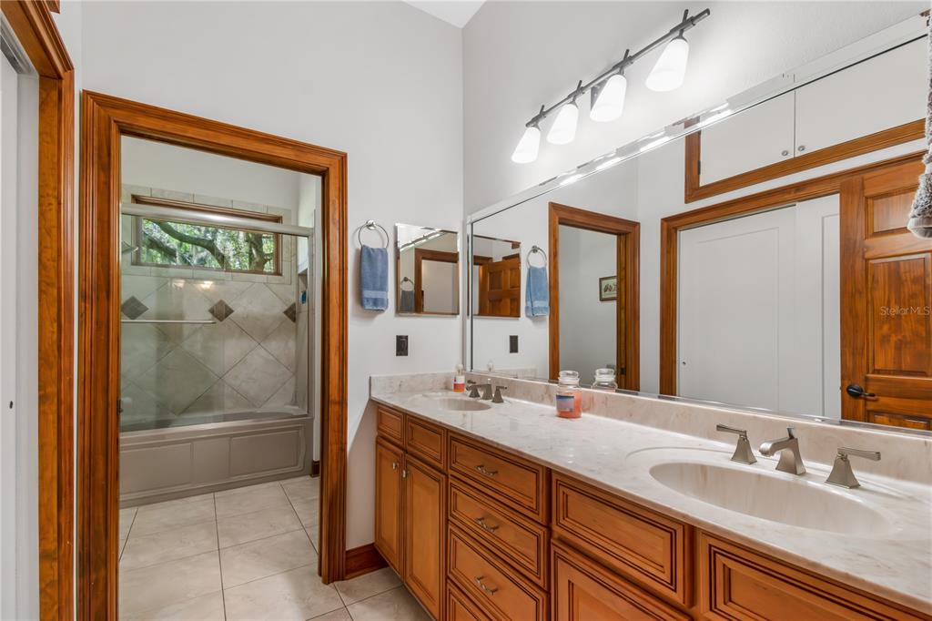 6140 Northwest 145th Avenue Road Morriston, FL 32668 - Photo 27 of 75 a bathroom with a double vanity sink and a mirror