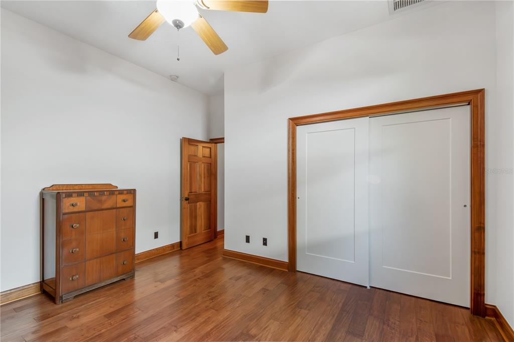 6140 Northwest 145th Avenue Road Morriston, FL 32668 - Photo 30 of 75 a view of an empty room with wooden floor and a window