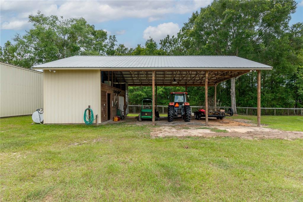 6140 Northwest 145th Avenue Road Morriston, FL 32668 - Photo 37 of 75 a view of a house with backyard and porch