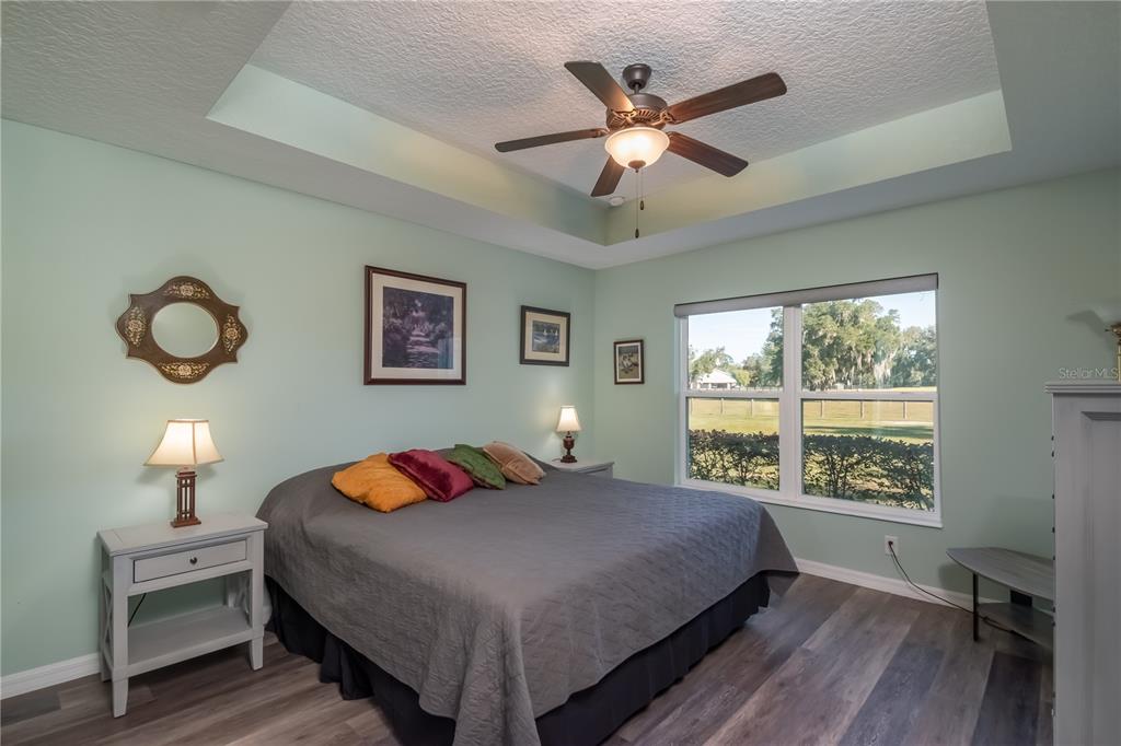 6140 Northwest 145th Avenue Road Morriston, FL 32668 - Photo 48 of 75 a bedroom with a large bed and a window
