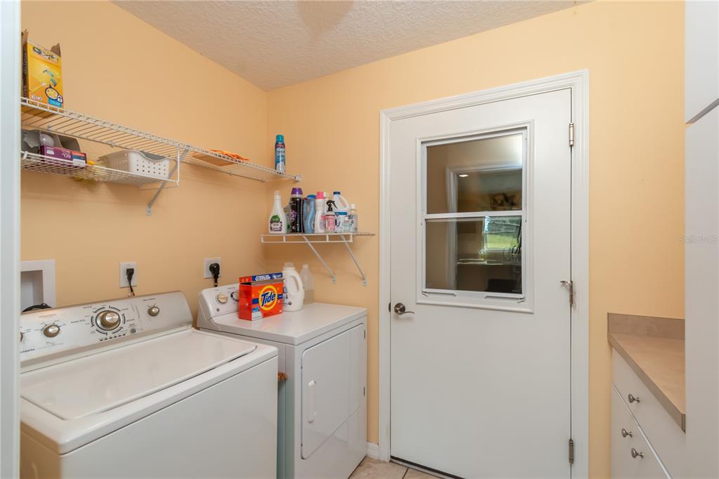 6140 Northwest 145th Avenue Road Morriston, FL 32668 - Photo 51 of 75 a utility room with dryer and washer