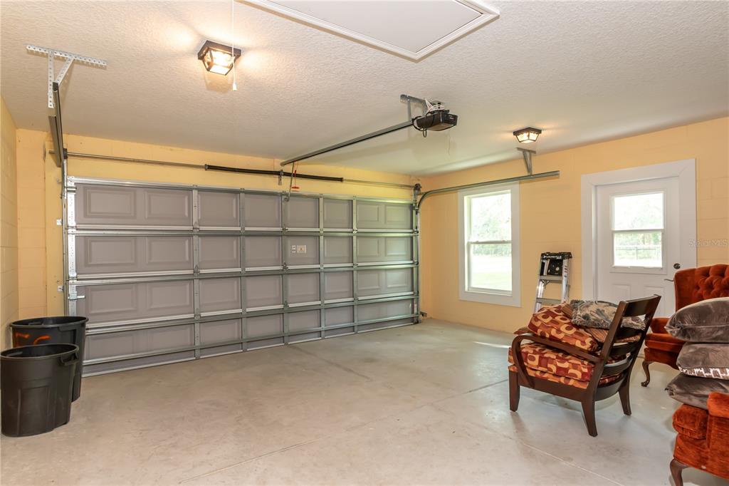 6140 Northwest 145th Avenue Road Morriston, FL 32668 - Photo 53 of 75 a view of a livingroom with furniture and a window
