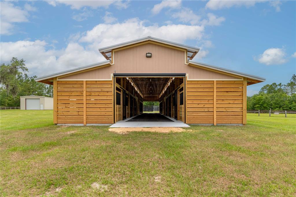 6140 Northwest 145th Avenue Road Morriston, FL 32668 - Photo 57 of 75 a front view of a house with a yard and garage