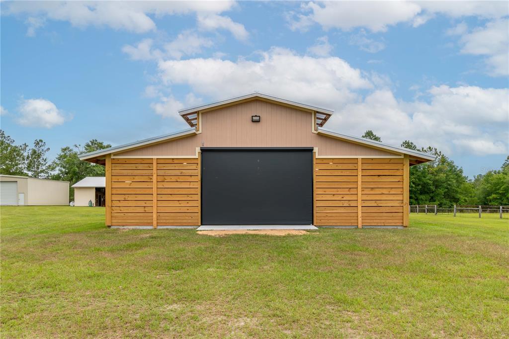 6140 Northwest 145th Avenue Road Morriston, FL 32668 - Photo 61 of 75 a front view of a house with a yard