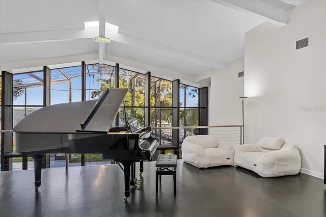 a living room with furniture and white walls