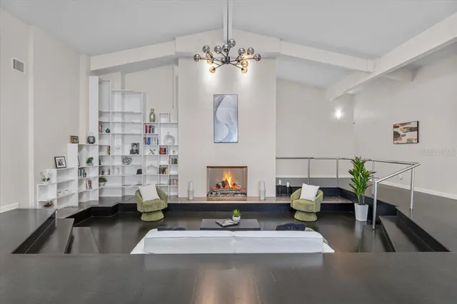 a kitchen with a table and chairs in it