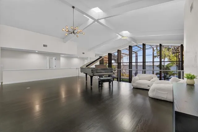 a view of a living room and kitchen