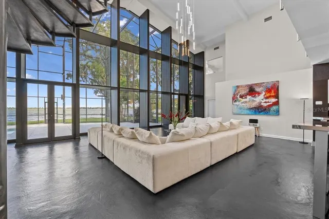a living room with couches and a flat screen tv
