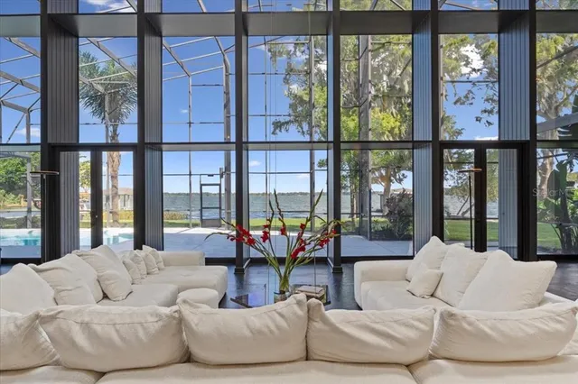 a spacious bedroom with a bed and a chandelier