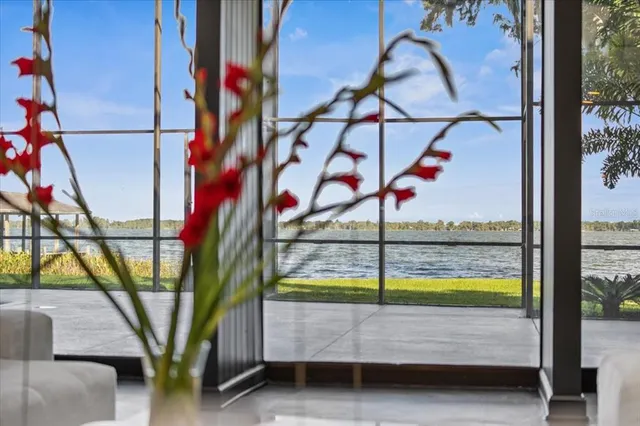 a kitchen with refrigerator and chairs