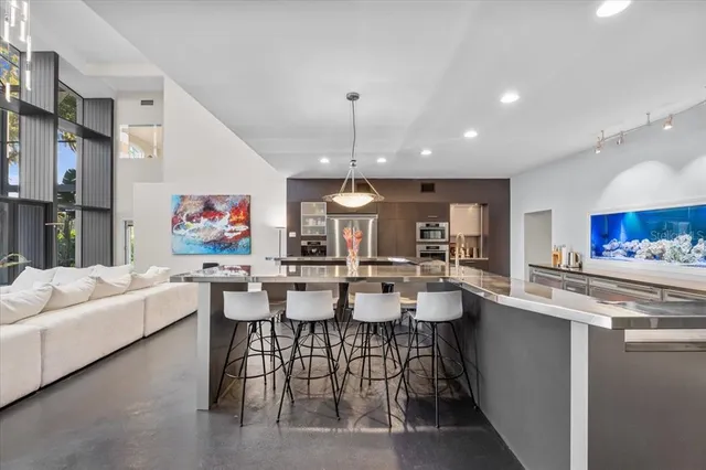 an empty room with furniture and a ceiling fan
